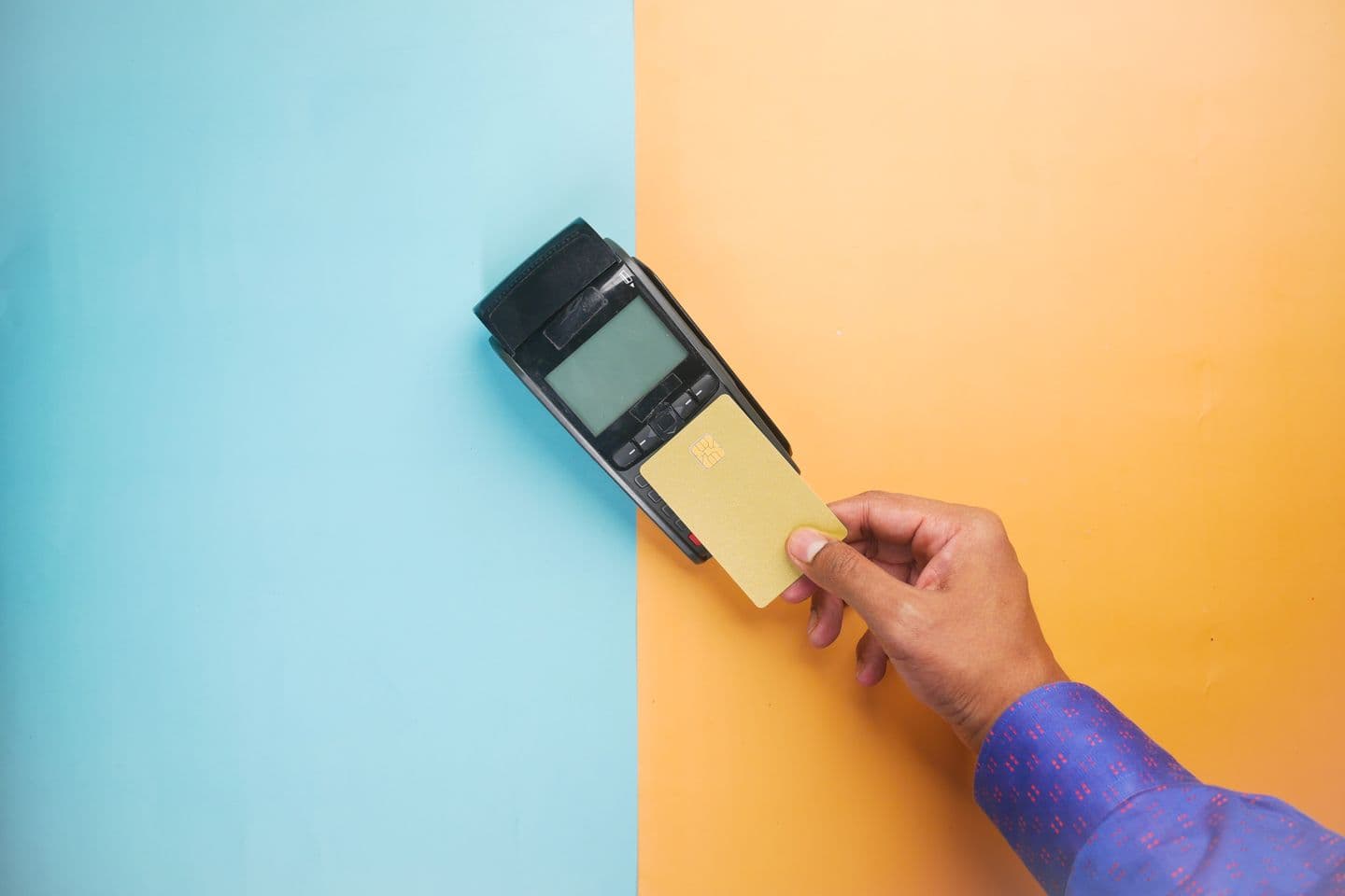 A contactless card payment at a terminal — every UK card transaction runs under an acquirer agreement that requires PCI DSS compliance