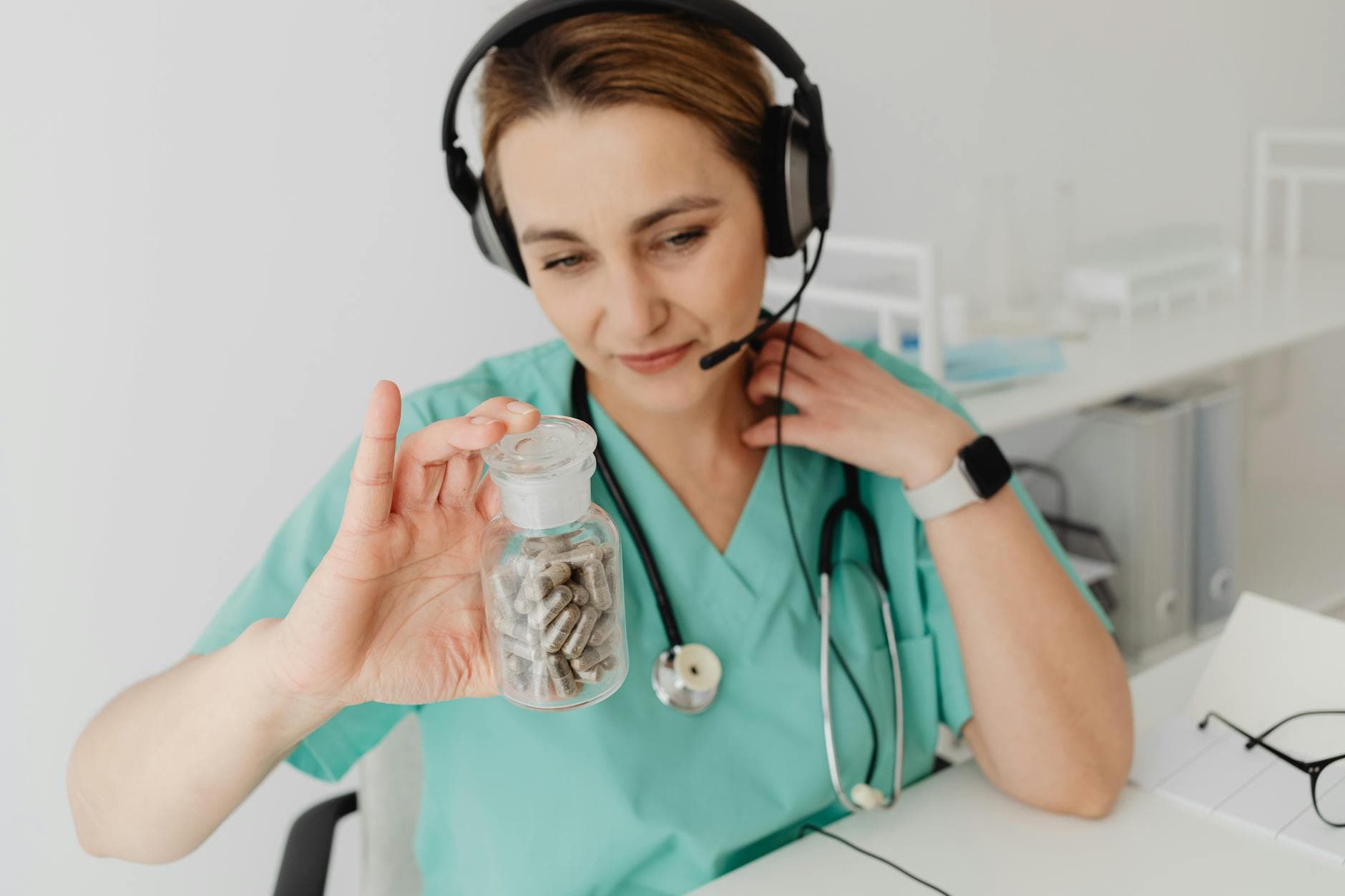 Patient making a card payment at a healthcare clinic counter using a card terminal