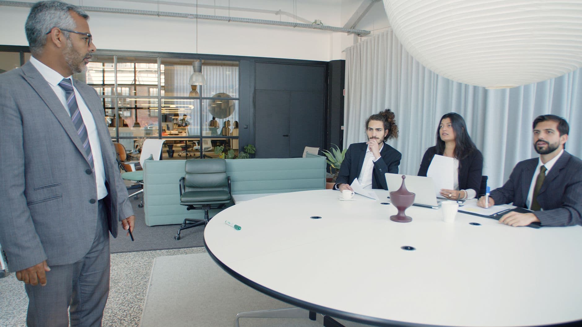 Enterprise executives in a modern conference room reviewing a secure payments programme