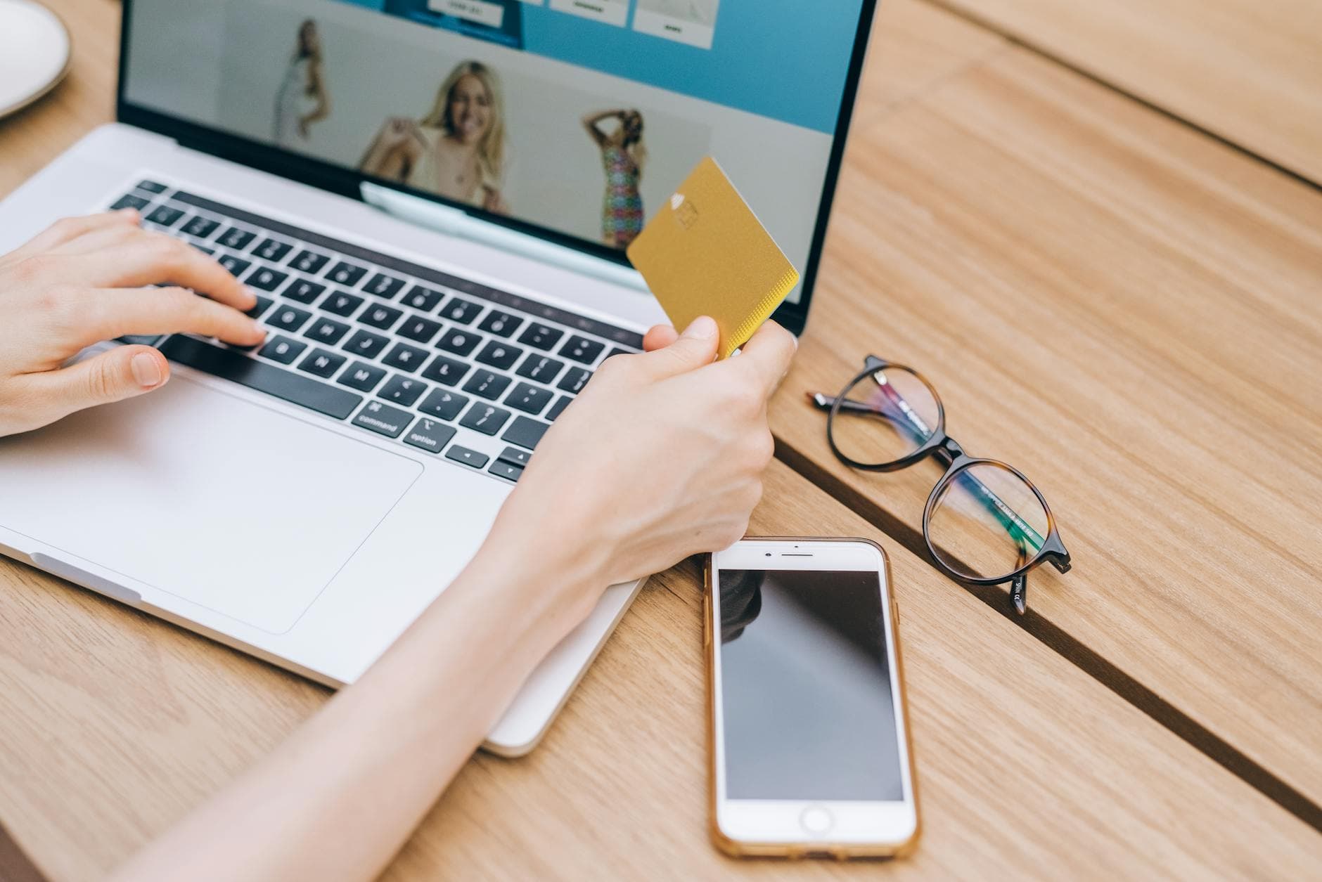 Customer paying online with a credit card on a laptop