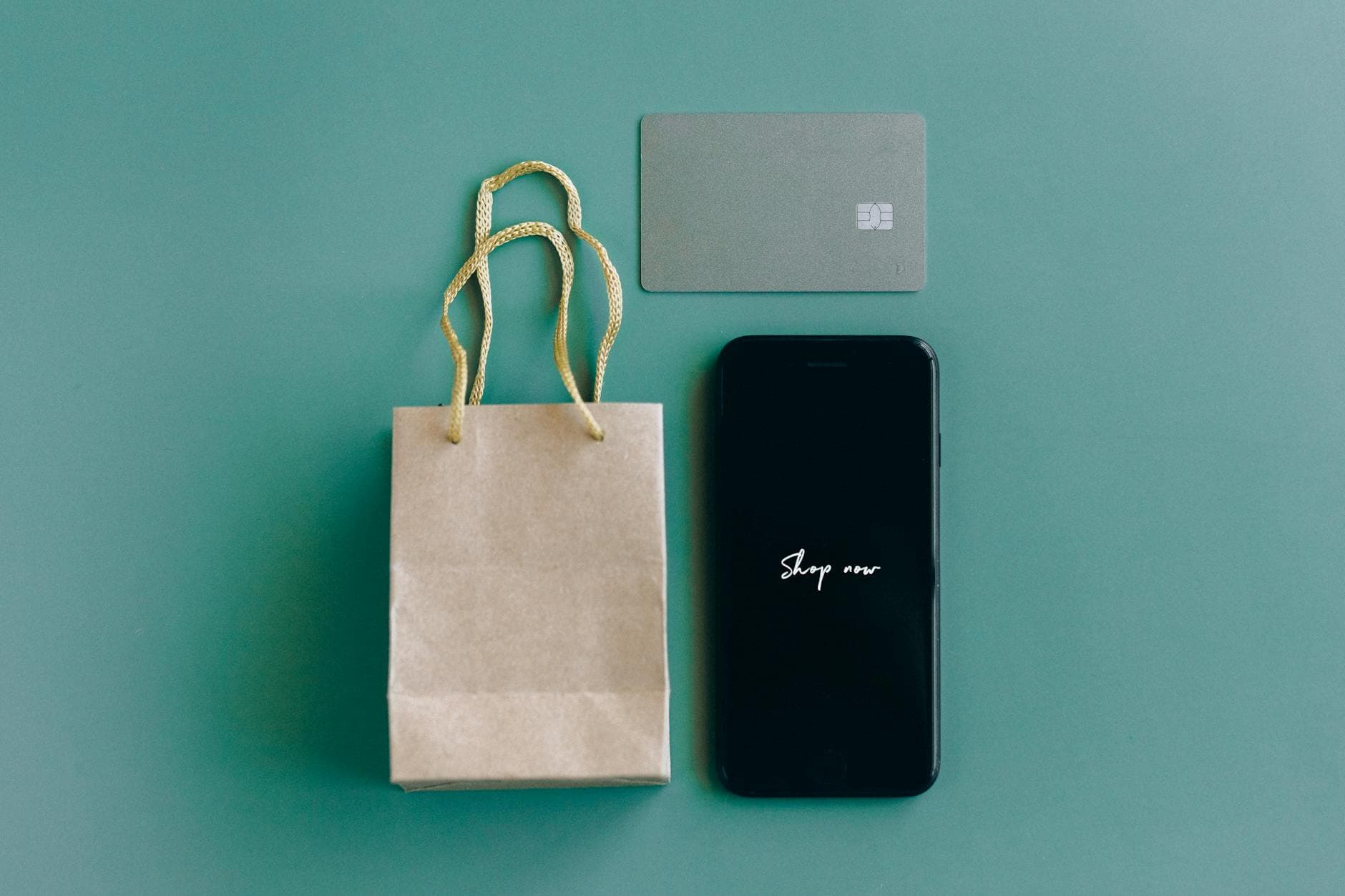 Mobile online shopping with credit card next to a smartphone