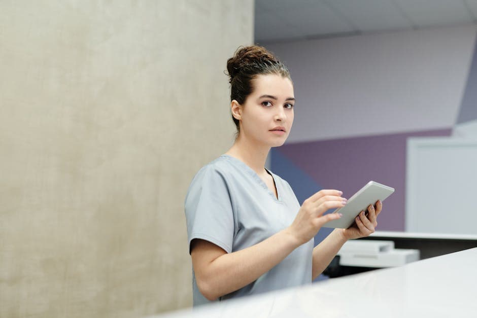 US hospital patient making a card payment at a reception desk