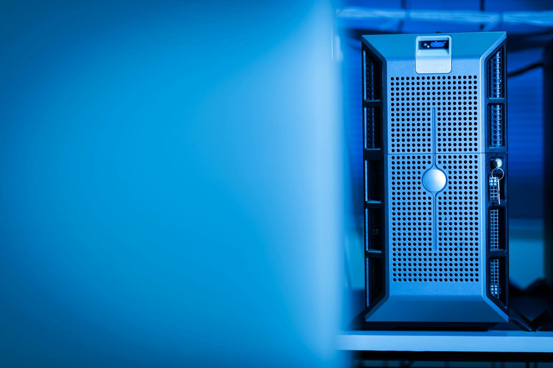 Close-up of a server rack in a blue-lit data center representing a secure tokenization vault