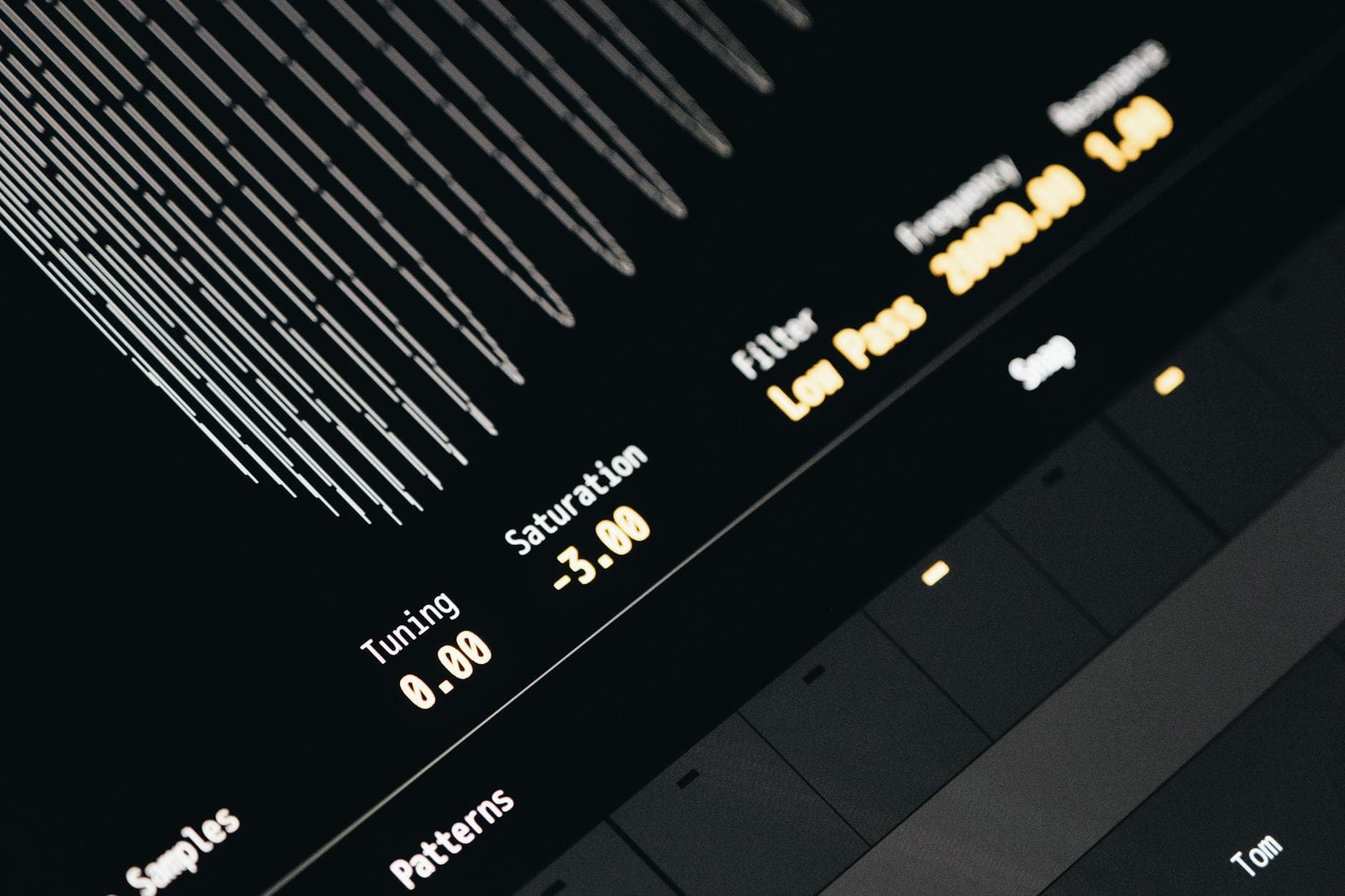 Close-up of a modern digital audio interface showing signal processing controls