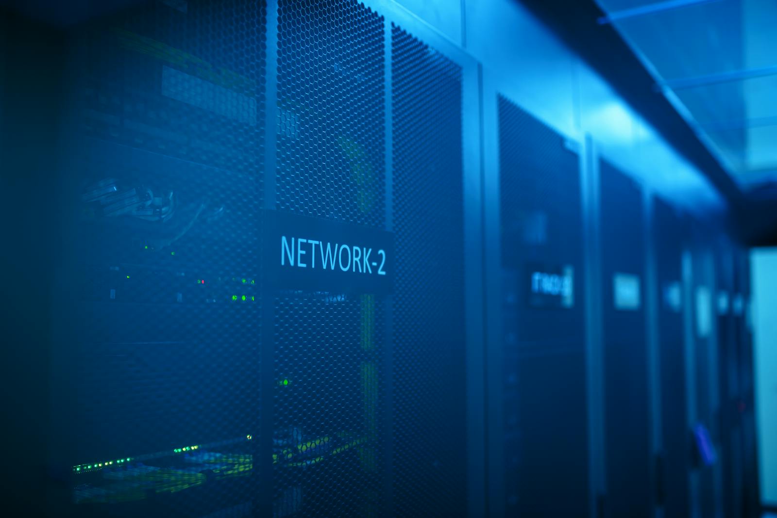 Server rack with network security firewall equipment representing the 12 PCI DSS requirements framework