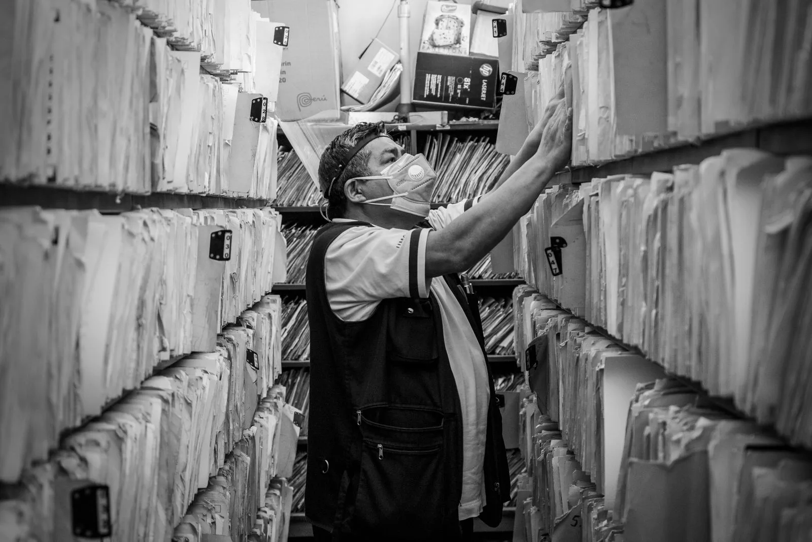 Overflowing filing cabinet with paper records representing unnecessary card data storage