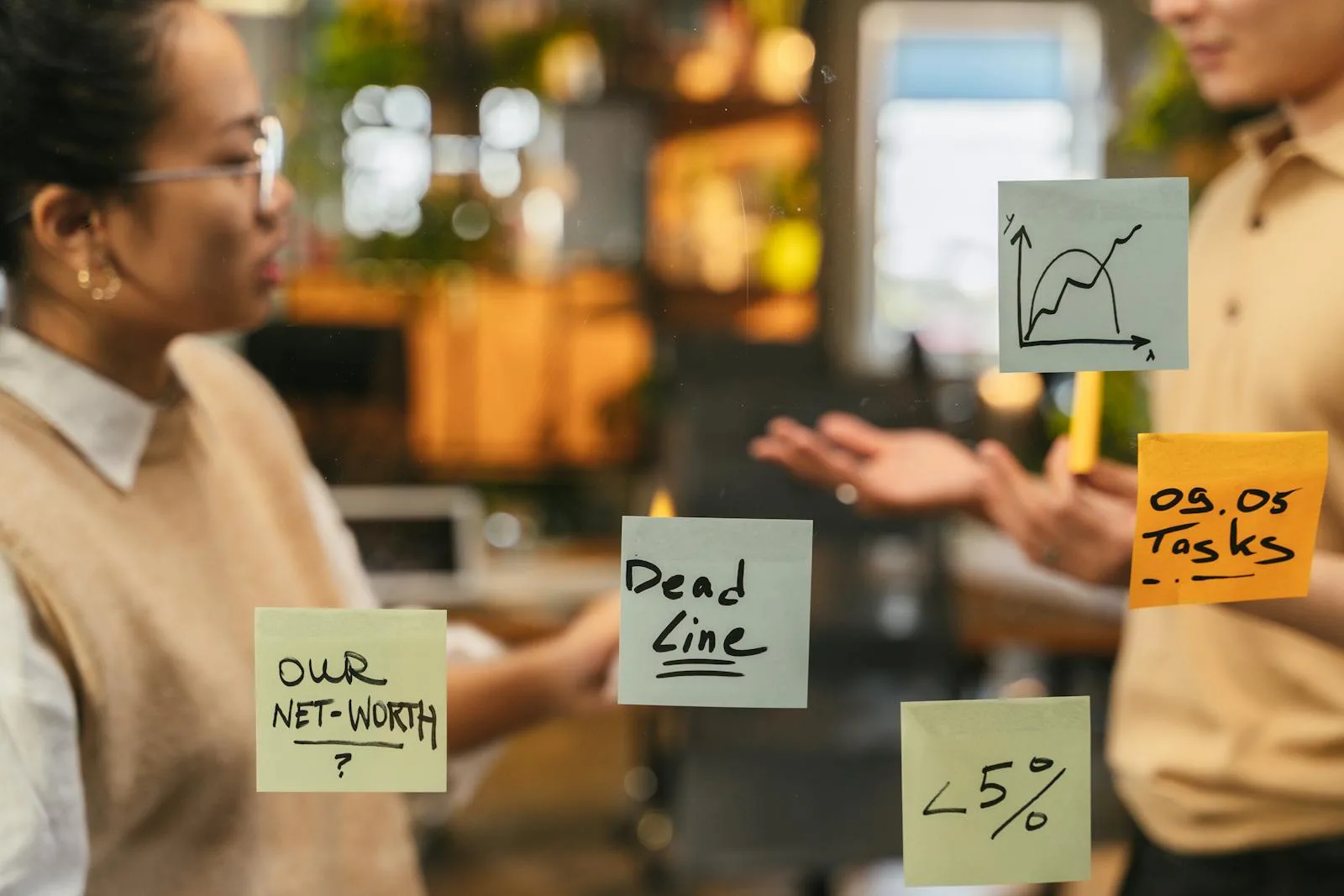 Team mapping payment data flows across systems using sticky notes on an office wall